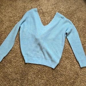Baby powder blue sweater with a cute tie in the back